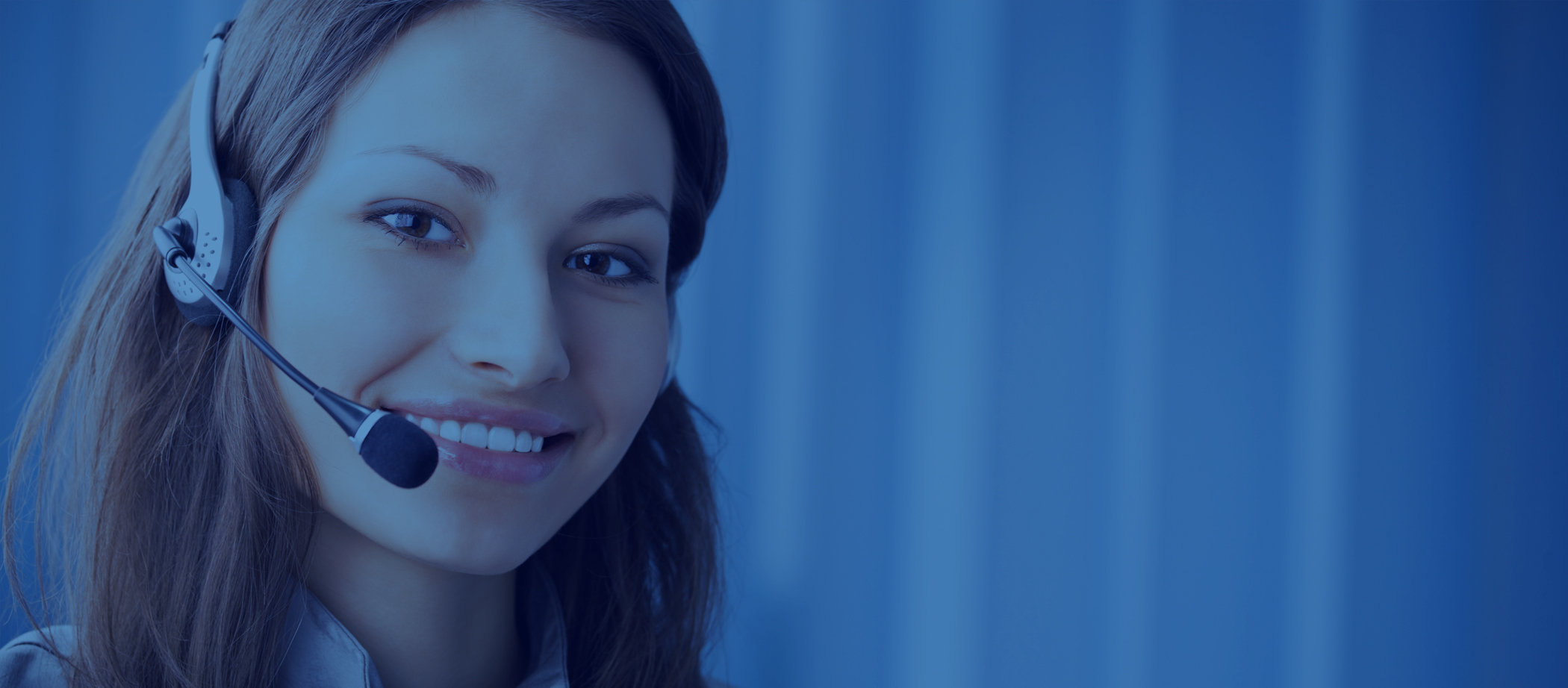 Woman with headset on in customer service position